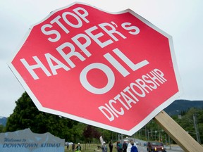 A sign opposing the Enbridge pipeline is shown in downtown Kitimat, B.C. Tuesday, June, 17, 2014. The pipeline, once built, would bring oil from Alberta to Kitimat on the British Columbia coast to be loaded on tankers and shipped around the world. (Jonathan Hayward/The Canadian Press)
