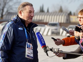 Vladislav Tretiak, a former goaltender for Russia's national ice hockey team, talks with reporters at the Sochi International Airport where NHL hockey players are arriving for the 2014 Winter Olympics, Monday, Feb. 10, 2014, in Sochi, Russia. (AP Photo/Mark Humphrey)