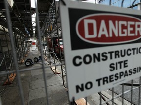 The scaffolding remains on the outside of the Paul Martin Building in Windsor on Wednesday, June 11, 2014.               (Tyler Brownbridge/The Windsor Star)