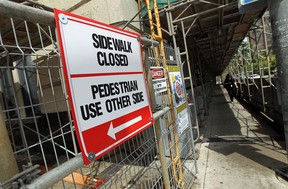 The scaffolding remains on the outside of the Paul Martin Building in Windsor on Wednesday, June 11, 2014.               (Tyler Brownbridge/The Windsor Star)