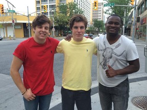 American Idol's Alex Preston, Sam Woolf, and C.J. Harris enjoy a walk down Ouellette Avenue in Windsor, Ontario on June 26, 2014.  They will be performing in the American Idol Experience Show at the Colosseum at Caesars Windsor on Friday evening. (JASON KRYK/The Windsor Star)
