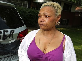 Adrienne Clinansmith stands in front of her home where a racist comment was spray painted on to her vehicle, Sunday, June 29, 2014.  (DAX MELMER/The Windsor Star)