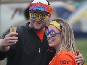 Wes Wright and Mallory Heyens snap a selfie at the Vollmer Complex in LaSalle, Ont. on Friday, June 20, 2014, during the Canadian Cancer Society Relay for Life event. It featured dozens of survivors and over 70 corporate teams. (DAN JANISSE/The Windsor Star)