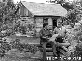 Jim Moir, left, and Les Dickens of the Windsor Branch of the Historic Vehicle Society of Ontario check over final plans for 18th century British and American battle re-enactment at the society's Heritage Village near Essex on June 14, 1977. (Walter Jackson/Windsor Star)