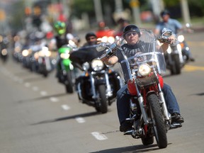 Participants in the Windsor Telus Motorcylce Ride for Dad make their way down Lauzon Road, Sunday, June 1, 2014.  The event raises funds to  support prostate cancer research and raise public awareness of the disease.  (DAX MELMER/The Windsor Star)