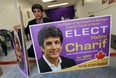 Helmi Charif holds ups a pair of election signs that were recent vandalized at his campaign office in Windsor on Wednesday, June 4, 2014.              (Tyler Brownbridge/The Windsor Star)