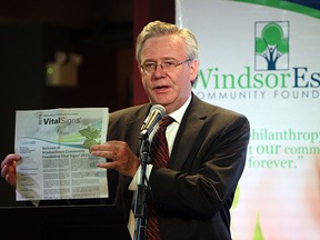 Robin Easterbrook from the Windsor Essex Community Foundation unveil the new Vital Signs survey in the News Cafe at the Windsor Star in Windsor on Monday, June 9, 2014.               (Tyler Brownbridge/The Windsor Star)