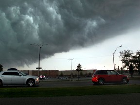A storm front passes over Devonshire Mall in Windsor, Ontario on June 18, 2014.  Heavy storms packed with lightning and heavy rain crosses southwestern Ontario Wednesday afternoon. (Jason Kryk/The Windsor Star)