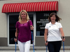 Registered physiotherapist Carolyn Sivitter, right, and The Star's Kelly Steele demonstrate nordic pole walking earlier this week. (NICK BRANCACCIO / The Windsor Star)