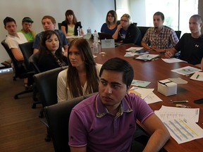 Young entrepreneurs Zaid Kaleem, front, Brenda Guenther, left, and about 20 other students attend Summer Company Program at Small Business Centre, part of WindsorEssex Economic Development Corp. located on California Avenue Friday July 4,  2014. (NICK BRANCACCIO/The Windsor Star)