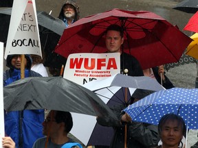 Members and supporters of Windsor University Faculty Association gather for a noon hour rally at the University of Windsor's Chrysler Hall TUESDAY July 8, 2014. (NICK BRANCACCIO/The Windsor Star)