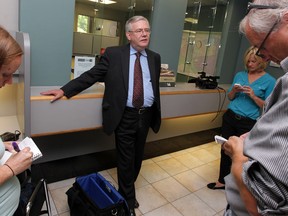 Reporters tweet the arrival of Robin Easterbrook at City Hall where he filed to become a candidate for mayor, Thursday July 10, 2014. (NICK BRANCACCIO/The Windsor Star)