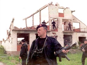 Suspected war criminal Zeljko 'Arkan' Raznatovic, centre, the Commander of the    Serbian volunteer detachment called 'The Tigers', observes a training session    of his unit near the front line in eastern Slavonia, in the outskirts of the    Croatian held town of Osijek 14 May. The situation in the area remains tense    following Croat attacks in western Slavonia. (AFP PHOTO/Milos JELESIJEVIC/ EPA)    05/15/95