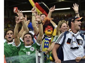 German supporters celebrate after the World Cup semifinal soccer match between Brazil and Germany at the Mineirao Stadium in Belo Horizonte, Brazil, Tuesday, July 8, 2014. Germany won the match 7-1. (AP Photo/Martin Meissner)