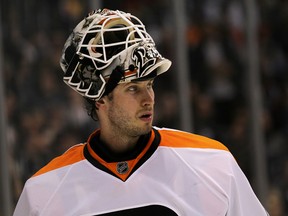 Former Flyers goaltender Michael Leighton takes a break during a game against the Los Angeles Kings on December 30, 2010 in Los Angeles, California.  (Stephen Dunn/Getty Images)