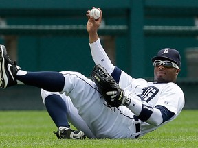 Tigers left-fielder Rajai Davis holds up the ball after catching a fly ball by Adrian Gonzalez of the Los Angeles Dodgers in the first inning at Comerica Park. (AP Photo/Paul Sancya)