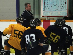 University of Windsor men's hockey coach Kevin Hamlin, top, instructs his team during practice at South Windsor Arena. (DAX MELMER/The Windsor Star)