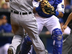 Kansas City's Salvador Perez, right, tags out Nick Castellanos of the Tigers on a fielder's choice in the seventh inning at Kauffman Stadium Friday. (Photo by Ed Zurga/Getty Images)