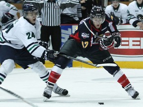 Windsor's Alex Aleardi, right, is checked by Plymouth's Rickard Rakell at the WFCU Centre. (DAX MELMER/The Windsor Star)