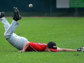 Windsor Selects left-fielder Casey Boutette dives for a fly ball during baseball action against the Windsor Stars at Cullen Field. (JASON KRYK/The Windsor Star)