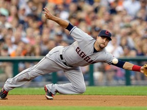 Cleveland third baseman Lonnie Chisenhall dives but misses a single by Detroit's J.D. Martinez during the fourth inning Friday in Detroit. (AP Photo/Carlos Osorio)