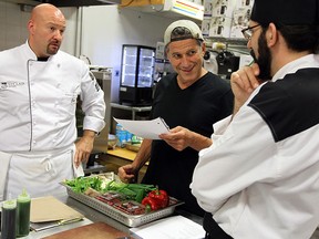 The Food Network's Bob Blumer works with chefs at Williams Restaurant Supply in Windsor on Friday, July 4, 2014. Blumer prepared a meal for 25 guest at the store and will be at the Fork & Cork Festival this weekend. (Tyler Brownbridge/The Windsor Star)