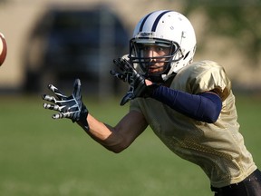 Wide receiver Ahmed Elsayed catches the ball at the opening of the AKO football camp at Jackson Park Monday. (DAX MELMER/The Windsor Star)