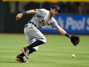 Detroit's Ian Kinsler makes a play on a ground ball during the fifth inning against the Arizona Diamondbacks at Chase Field Monday  in Phoenix. (Photo by Norm Hall/Getty Images)