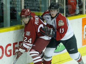 Windsor's Rob Kwiet, left, checks Guelph's Luke Pither in 2008. (Star file photo)