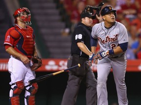 Detroit's Miguel Cabrera, right, hits a solo homer as catcher Chris Iannetta of the Los Angeles Angels of Anaheim looks on in the fourth inning at Angel Stadium Friday. (Photo by Jeff Gross/Getty Images)