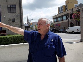 Royal Windsor Terrace resident Francis Fortin has heard plenty of complaints about noise and loud, thumping music coming from local bars LEV3L Vodka Emporium, behind, left, and twentyninepark, beind right,  July 28, 2014.  (NICK BRANCACCIO/The Windsor Star)