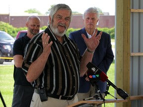 Files: Tom Bain, centre, along with Mark Williams, left, of Ontario Harness Horse Assoc. and MPP Rick Nichols announce a total of 13 race dates for Lakeshore Horse Racing Association to be held at Leamington Fair Grounds starting September 7, 2014.  (NICK BRANCACCIO/The Windsor Star)