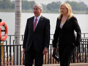 Transport Minister Lisa Raitt, right, and Michigan Governor Rick Snyder arrive to announce appointments to International Authority and Windsor-Detroit Bridge Authority during a press conference at Canadian Club Heritage Centre located at Hiram Walker's July 30, 2014. (NICK BRANCACCIO/The Windsor Star)