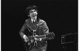 This Feb. 11, 1964 image provided by the David Anthony Fine Art gallery in Taos, N.M., shows a photograph of George Harrison taken by photographer Mike Mitchell during the Beatles first live U.S. concert at the Washington Coliseum.