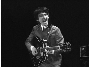 This Feb. 11, 1964 image provided by the David Anthony Fine Art gallery in Taos, N.M., shows a photograph of George Harrison taken by photographer Mike Mitchell during the Beatles first live U.S. concert at the Washington Coliseum.