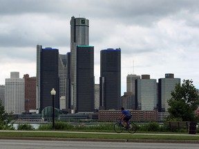 A cyclist makes their way up along the Detroit Riverfront and past downtown Detroit on a mild day in Windsor on Thursday, July 3, 2014.          (Tyler Brownbridge/The Windsor Star)