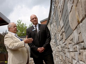 Director of public affairs for the Windsor Essex Hospitals Foundation Ron Foster, left, shows BMO regional vice-president Remo DiPaolo the healing wall, Wednesday, July 30, 2014, at Hotel Dieu Grace Healthcare complex on Prince Road. DiPaolo presented the hospital with a cheque for $70,000 on behalf of BMO. (RICK DAWES/The Windsor Star)