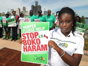 Stephanie Aigbe-Joseph, organizer for NIDO (Nigeria in diaspora organization) America, participates in a demonstration to raise awareness for the ongoing struggles with the terrorist group, Boko Haram, Saturday, July 5, 2014.  (DAX MELMER/The Windsor Star)
