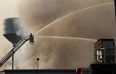 Firefighters battle the blaze at the Bonduelle plant in Tecumseh on July 18, 2014. (Dan Janisse / The Windsor Star)