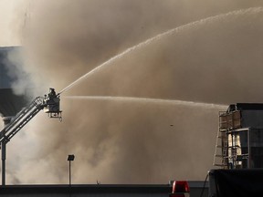 Firefighters battle the blaze at the Bonduelle plant in Tecumseh on July 18, 2014. (Dan Janisse / The Windsor Star)