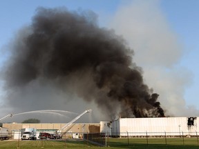 Smoke rises from the fire scene at the Bonduelle plant in Tecumseh on July 18, 2014. (Dan Janisse / The Windsor Star)