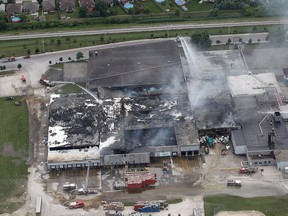 An aerial view of the Bonduelle plant fire taken approximately 13 hours after it started in Tecumseh, Ont. on Friday, July 18, 2014. (DAN JANISSE/The Windsor Star)