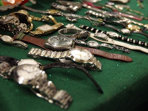 An assortment of watches recovered by Windsor police from a break-in suspect on July 16, 2014. (Tyler Brownbridge / The Windsor Star)