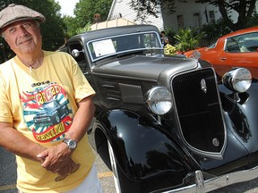 Bill Ball stands next to his 1934 Plymouth P.E. Business Coupe, at Amherstburg's Gone Car Crazy Show 'n' Shine, Sunday, July 27, 2014.  The car was built at the Windsor Assembly Plant.  (DAX MELMER/The Windsor Star)