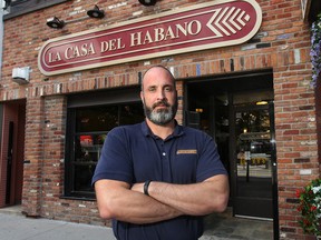 Jay Henderson, manager of the La Casa Del Habano cigar shop in downtown Windsor, Ont. would like to have a patio in front of the Ouellette Ave. store but the city is not allowing it. (DAN JANISSE/The Windsor Star)