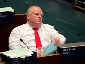 Toronto Mayor Rob Ford reacts during City Council at City Hall in Toronto, Ontario on Wednesday, July 9, 2014.   (Laura Pedersen/Postmedia News)