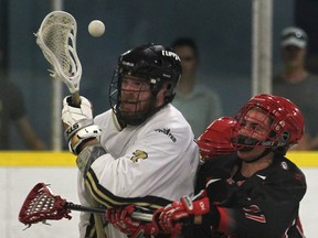 Windsor's Gianni Martinello, left, nd Wallaceburg's Drake Brown battle for the ball during their playoff game Wednesday, July 2, 2014, at Forest Glade Arena in Windsor, Ont. (DAN JANISSE/The Windsor Star)