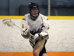 Windsor's Jarred Riley controls the ball against Wallaceburg during a playoff game Wednesday, July 2, 2014, at Forest Glade Arena in Windsor, Ont. (DAN JANISSE/The Windsor Star)