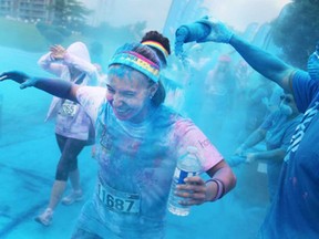 Participants in The Color Run 5k soak up the coloured dye along Windsor's riverfront, Saturday, July 19, 2014.  Nearly 10,000 people participated in the event.  (DAX MELMER/The Windsor Star)