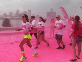 Participants in The Color Run 5k soak up the coloured dye along Windsor's riverfront, Saturday, July 19, 2014.  Nearly 10,000 people participated in the event.  (DAX MELMER/The Windsor Star)